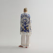 Load image into Gallery viewer, A model showcasing the back design of World Tree blue silk women's pajama set by Morgan & Tina.