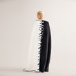 Load image into Gallery viewer, A woman wearing a Morgan&Tina black and white bath towel.